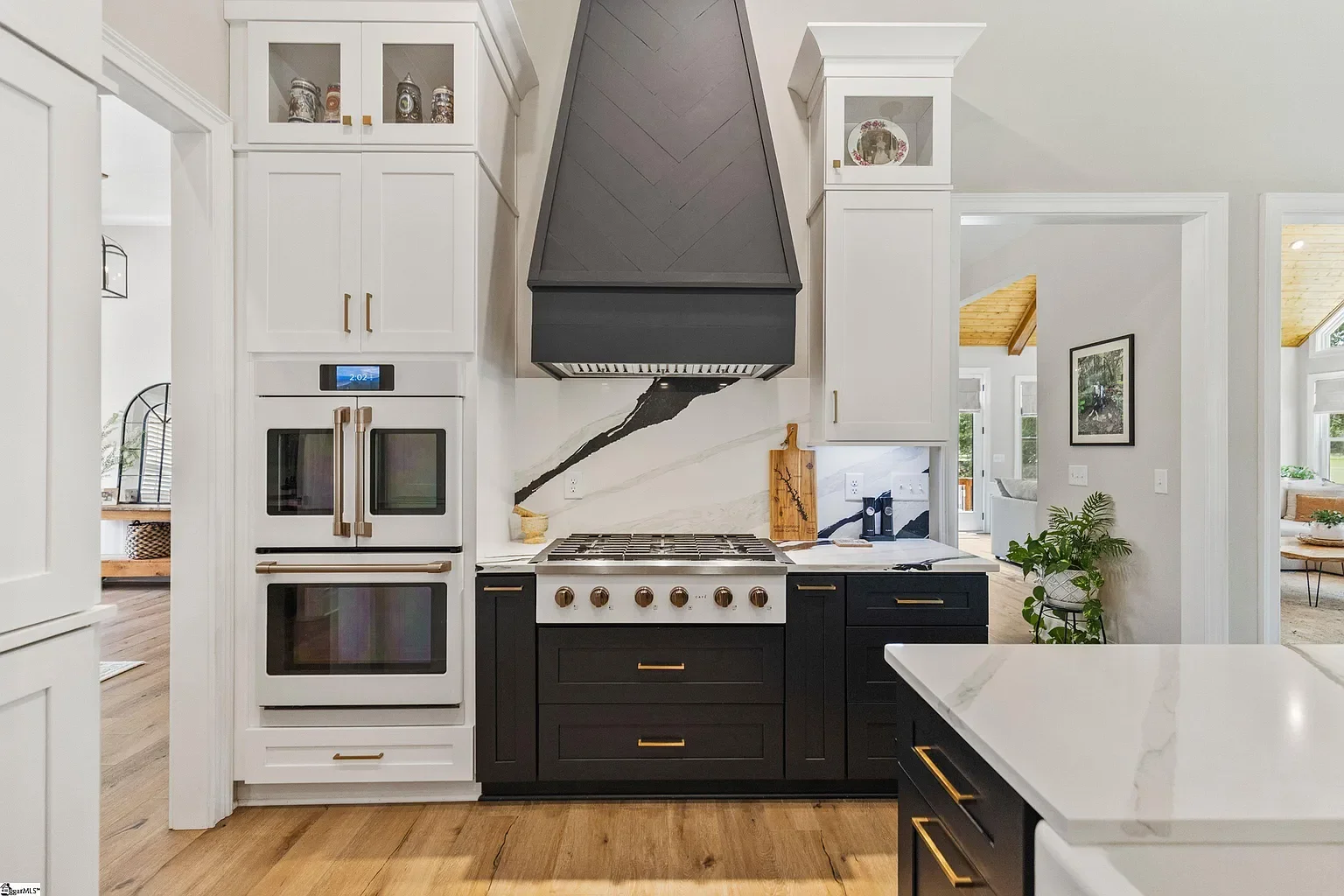 Modern kitchen design by Josh Timms Builders featuring sleek cabinets, double oven, and spacious layout.