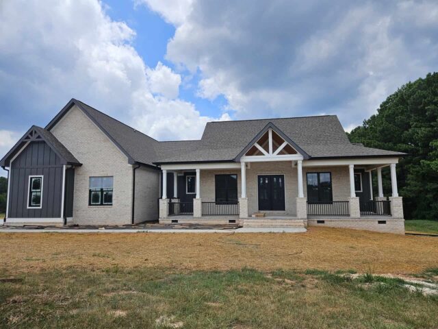 Custom home with modern brick design on your land upstate, ideal for turning your land into your dream home.